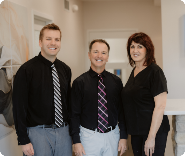 woman holding clear aligners